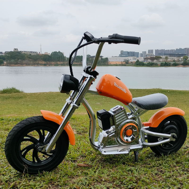 “Youmota Kids Electric Ride-On Motorcycle – 12” Air Tires, LED Lights, 10MPH, 150lb Max, Twist-Grip Throttle, Sound Effects - Orange