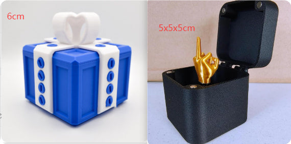 I Got It First annoying gift box gag present with blue present box and black box with gold middle finger inside