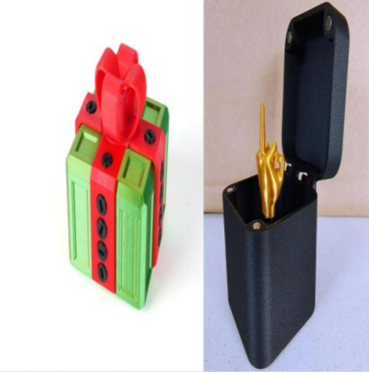 I Got It First annoying gift box gag present with green and red wrapped design and black box with golden middle finger figure