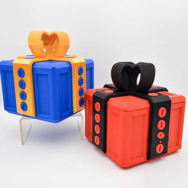 I Got It First annoying gift box gag present in blue and red with screw details and heart-shaped bows